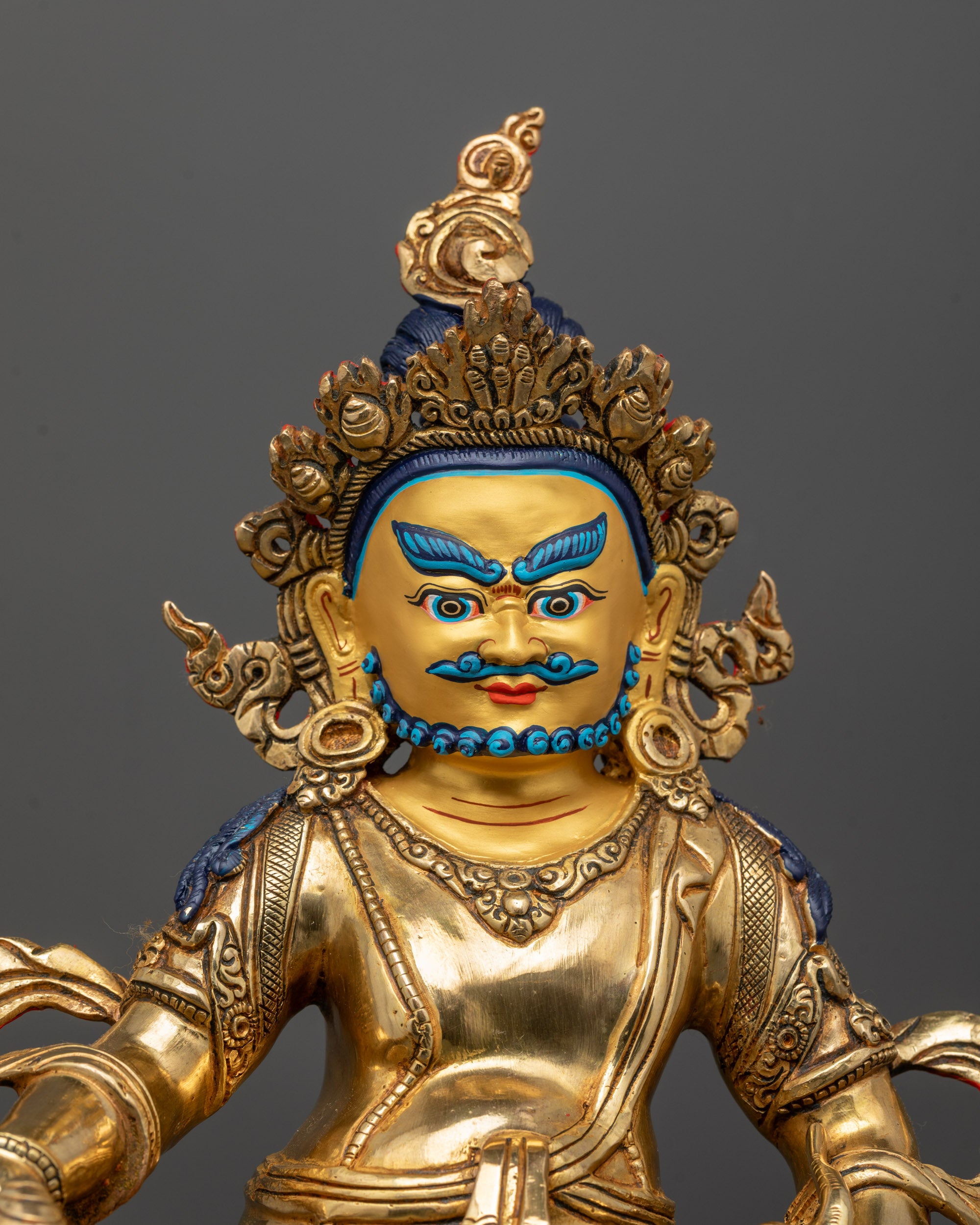 Close-up of Jambhala Statue showing intricate copper carvings