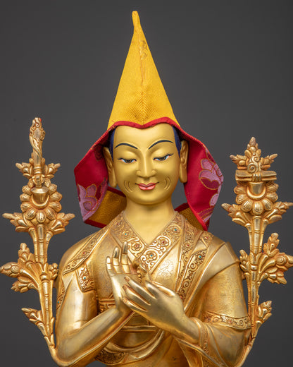 Close-up of Je Tsongkhapa's serene, gold-gilded face with a yellow Pandita hat and intricate lotus base.