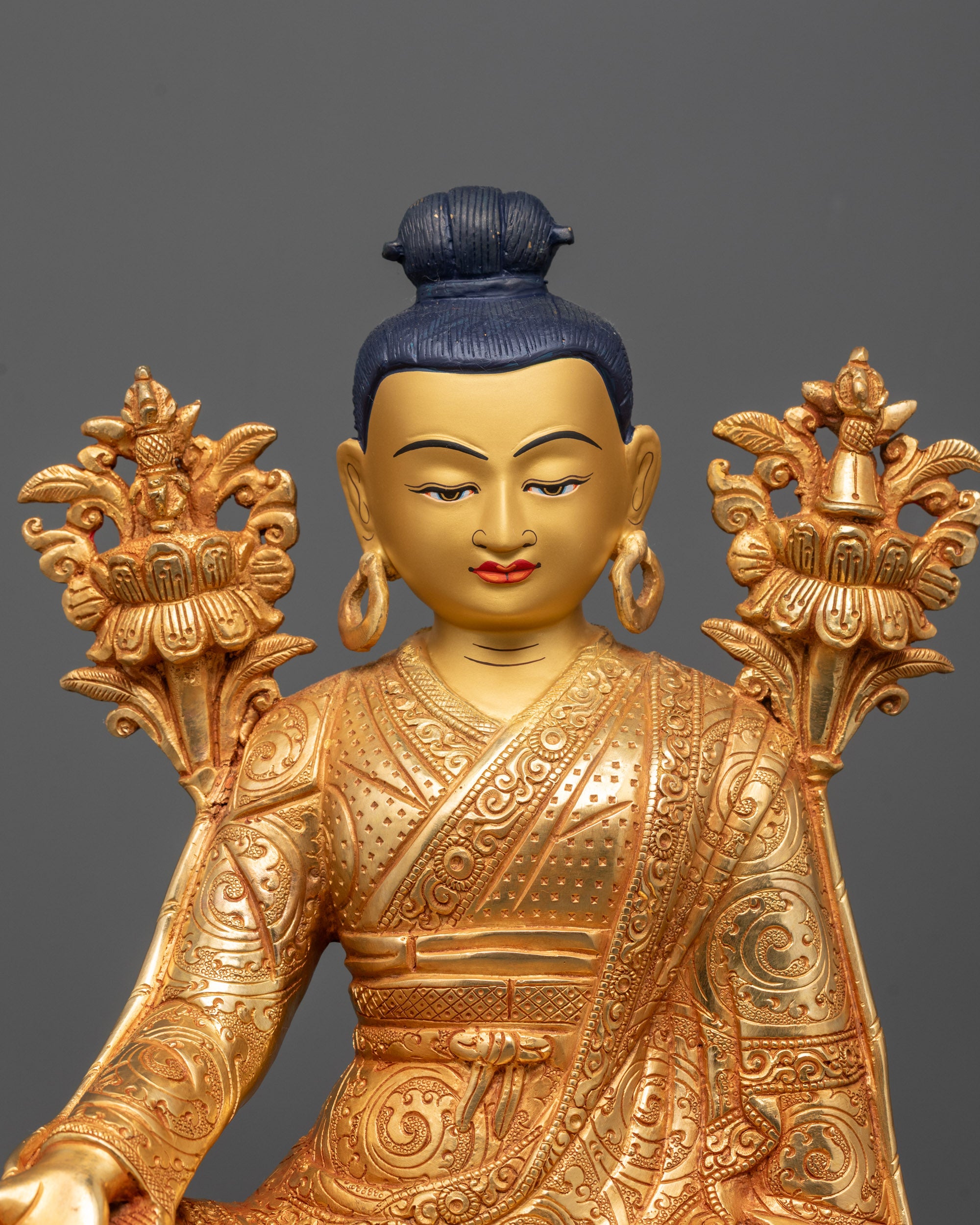 Close-up of Jigme Lingpa Statue face and 24k gold gilded features