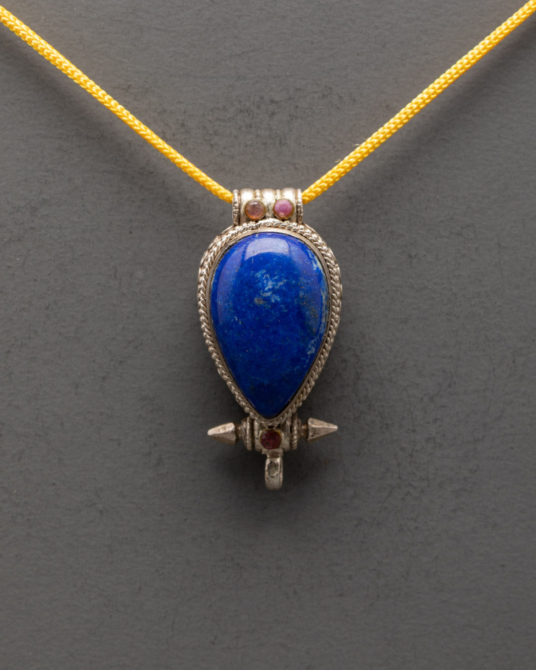 Close-up of Lapis Lazuli centerpiece on handcrafted Tibetan silver pendant
