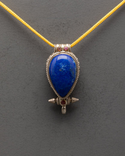 Close-up of Lapis Lazuli centerpiece on handcrafted Tibetan silver pendant
