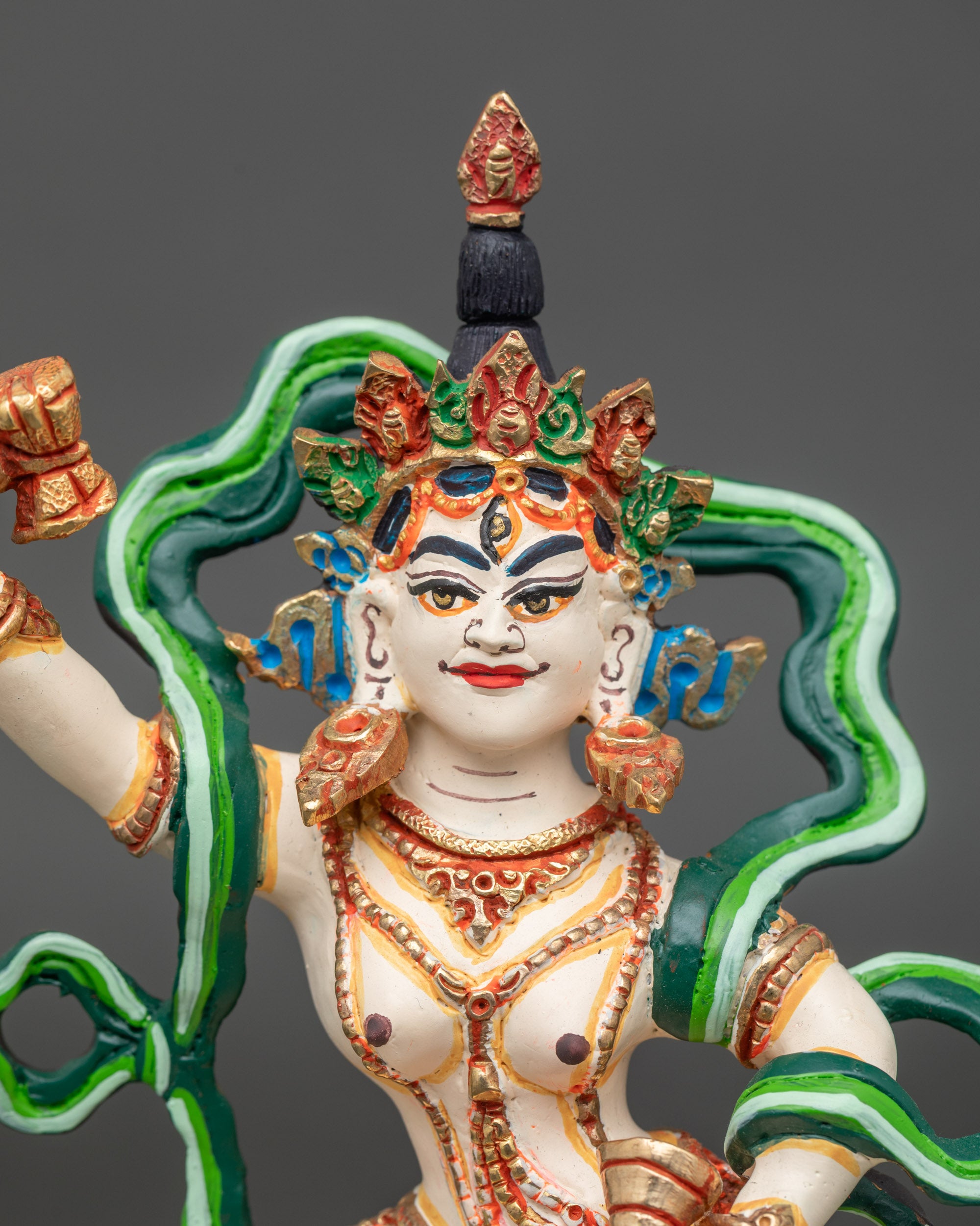 Close-up of Machig Labdron white dakini with damaru and ghanta