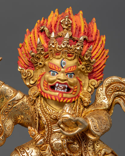 Close-up of Mahakala Bernagchen face with 24K gold-painted features and blazing halo
