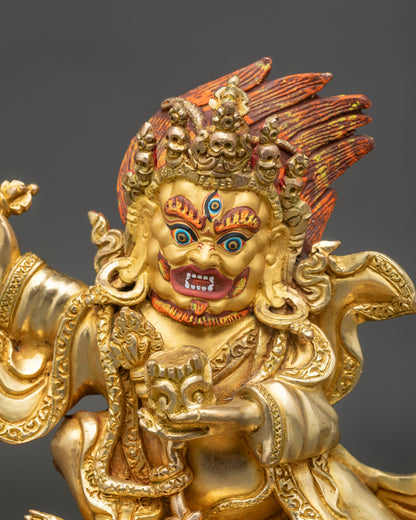 Close-up of Mahakala Bernagchen face with 24K gold-painted features and fierce expression