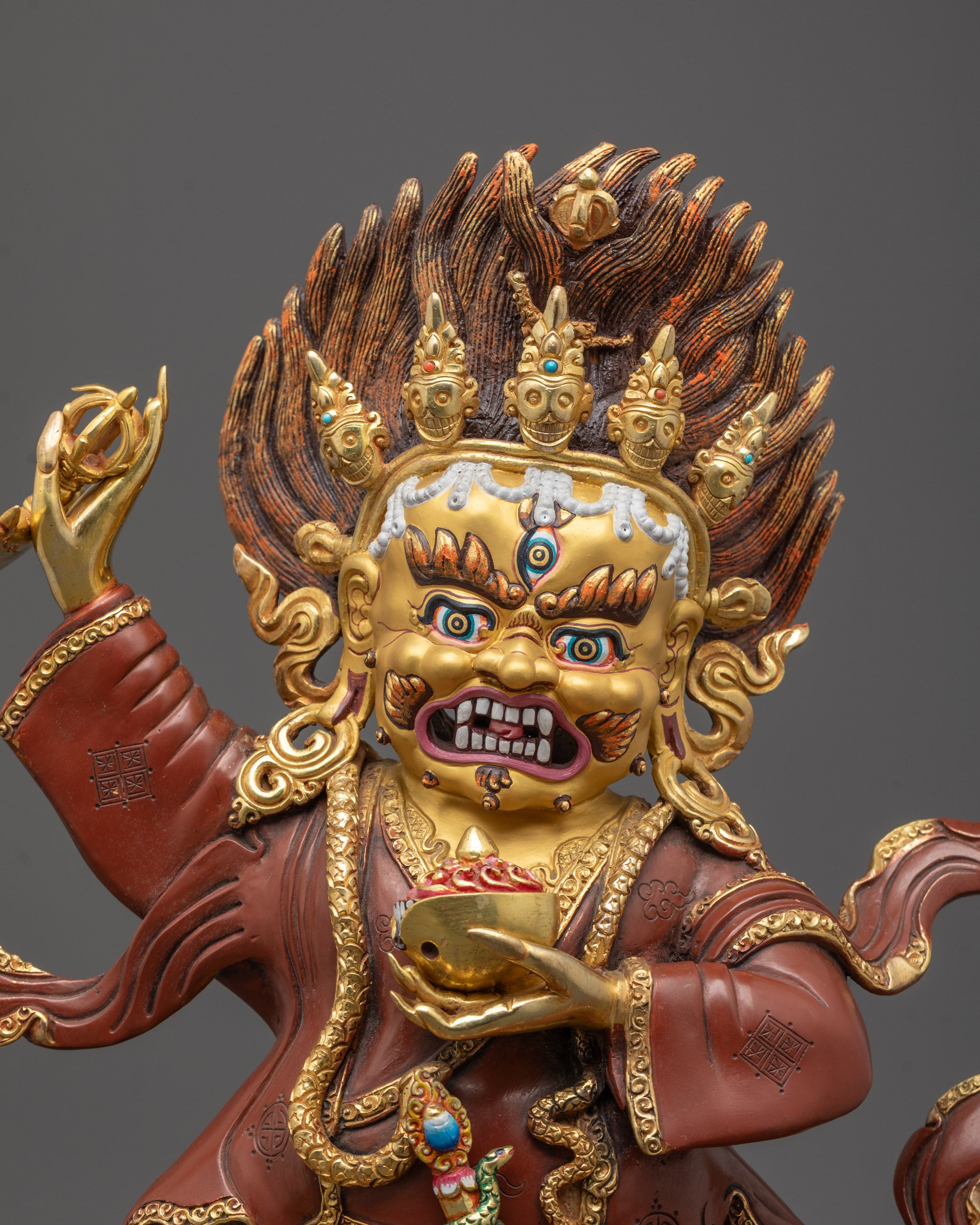 Close-up of Mahakala Bernagchen’s fierce expression and curved knife