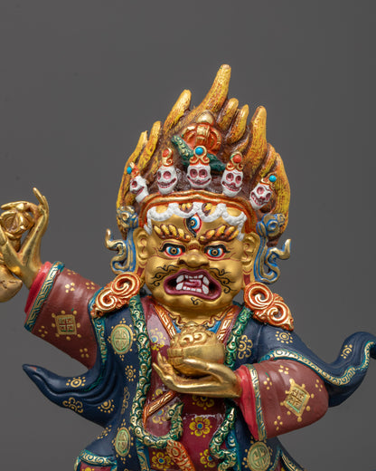 Close-up of Mahakala Bernagchen's wrathful face gilded with 24k gold,