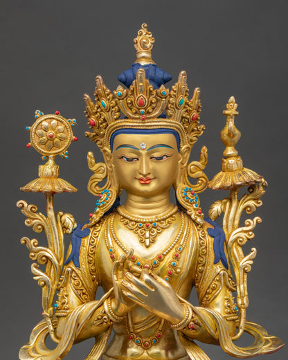 Close-up of Maitreya Buddha gold-painted face with semi-precious stone details
