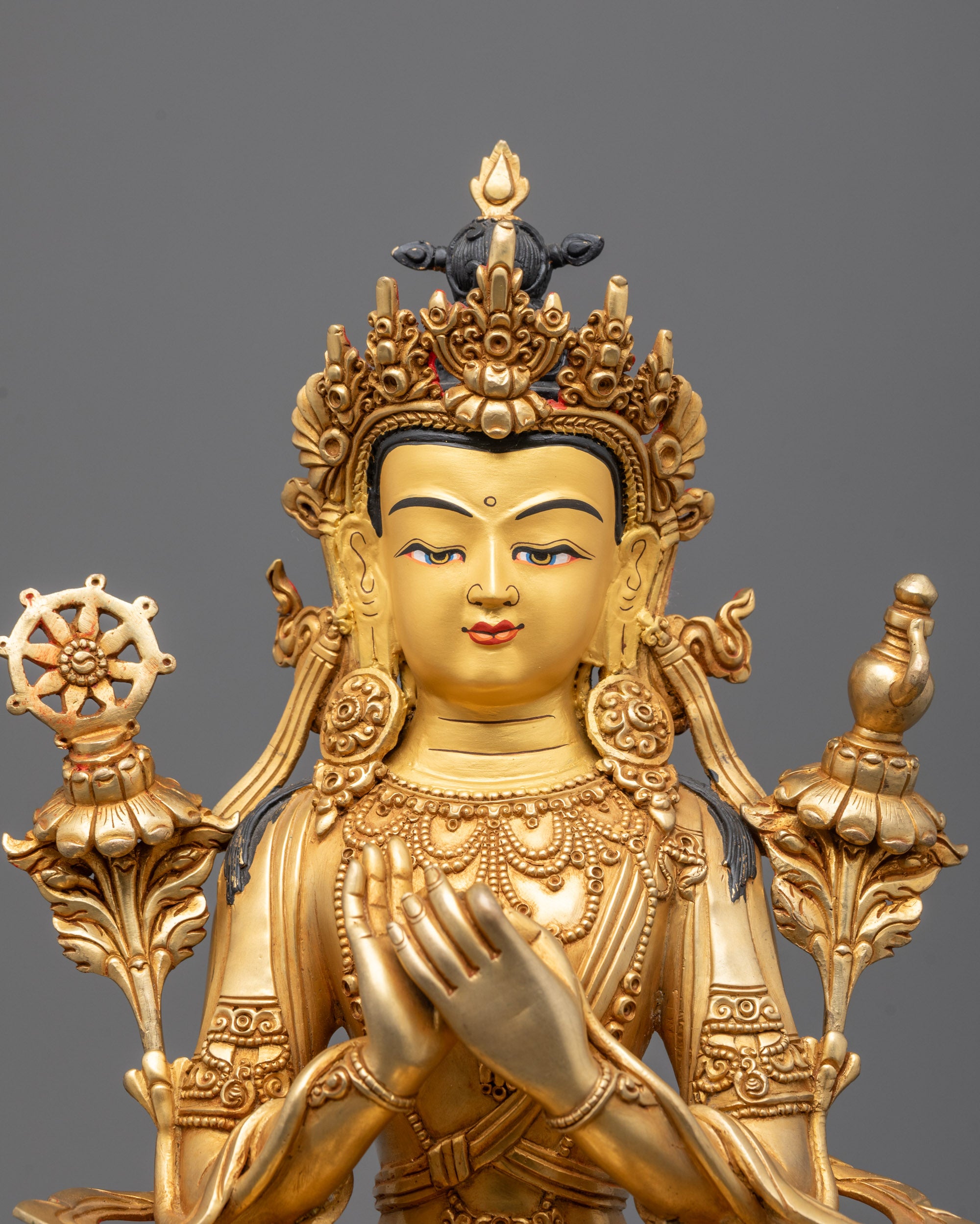Close-up of Maitreya Buddha’s serene face with intricate crown and halo