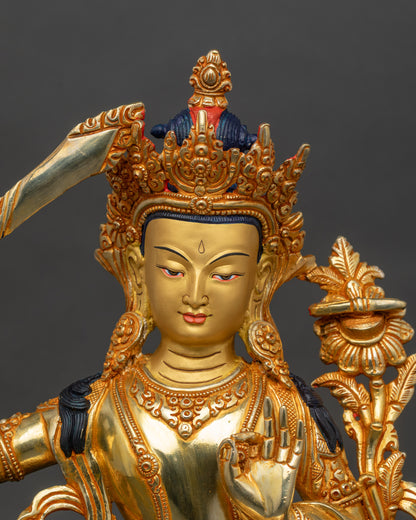 Close-up of Manjushri Bodhisattva face, gold-painted, crafted by Newari artisan