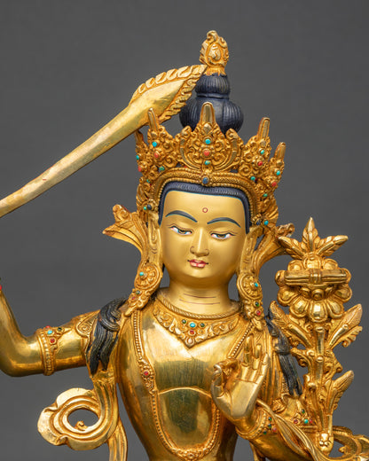 Close-up of Manjushri Bodhisattva face with 24k gold gilding, Himalayan Buddhist art