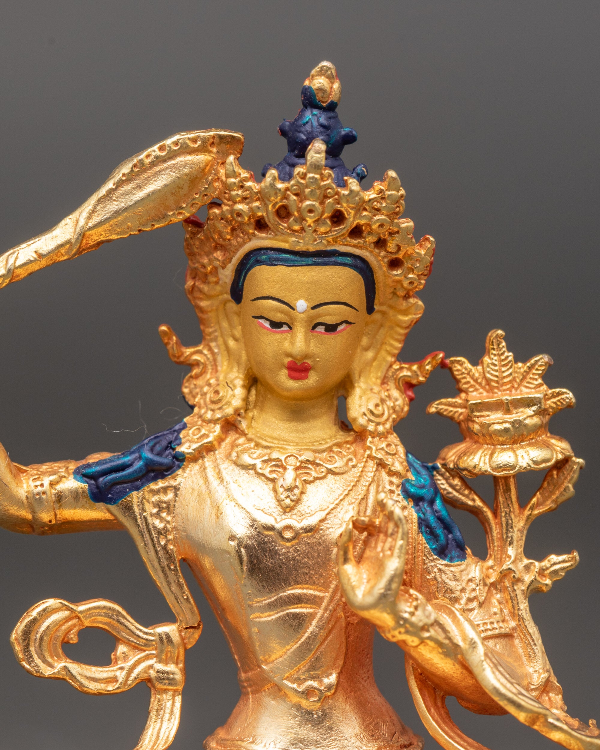 Close-up of Manjushri Bodhisattva holding flaming Wisdom Sword and Prajnaparamita Sutra
