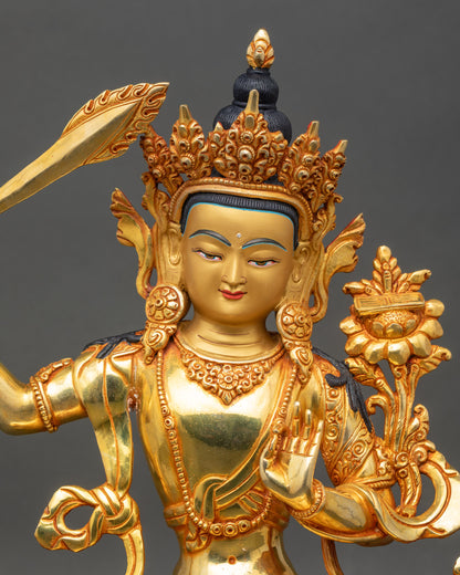 Close-up of Manjushri Buddha Statue face, serene expression with gold-painted details, Patan craftsmanship
