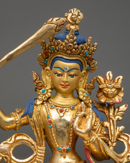Close-up of Manjushri Buddha Statue showing intricate robes and crown details