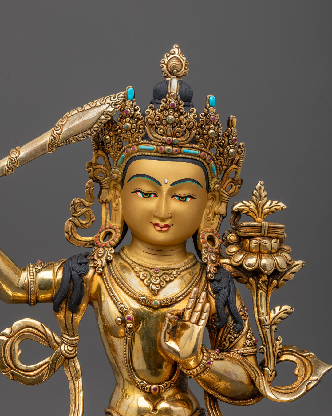 Close-up of Manjushri Sculpture crown, sword, Prajna Paramita, semi-precious stones detail