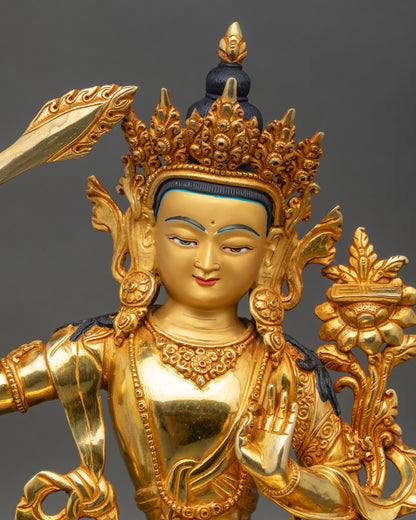 Close-up of Manjushri golden face with serene expression and wisdom sword