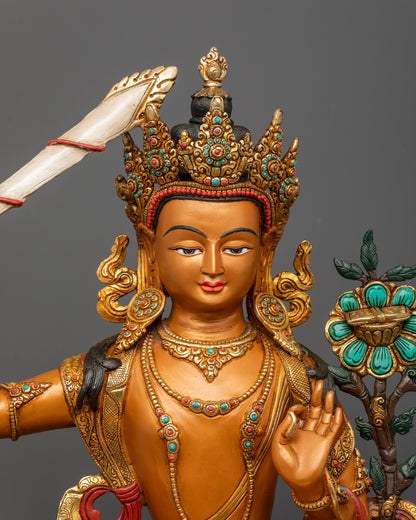 Close-up of Manjushri’s crown, jewelry, and flame of wisdom sword detailing