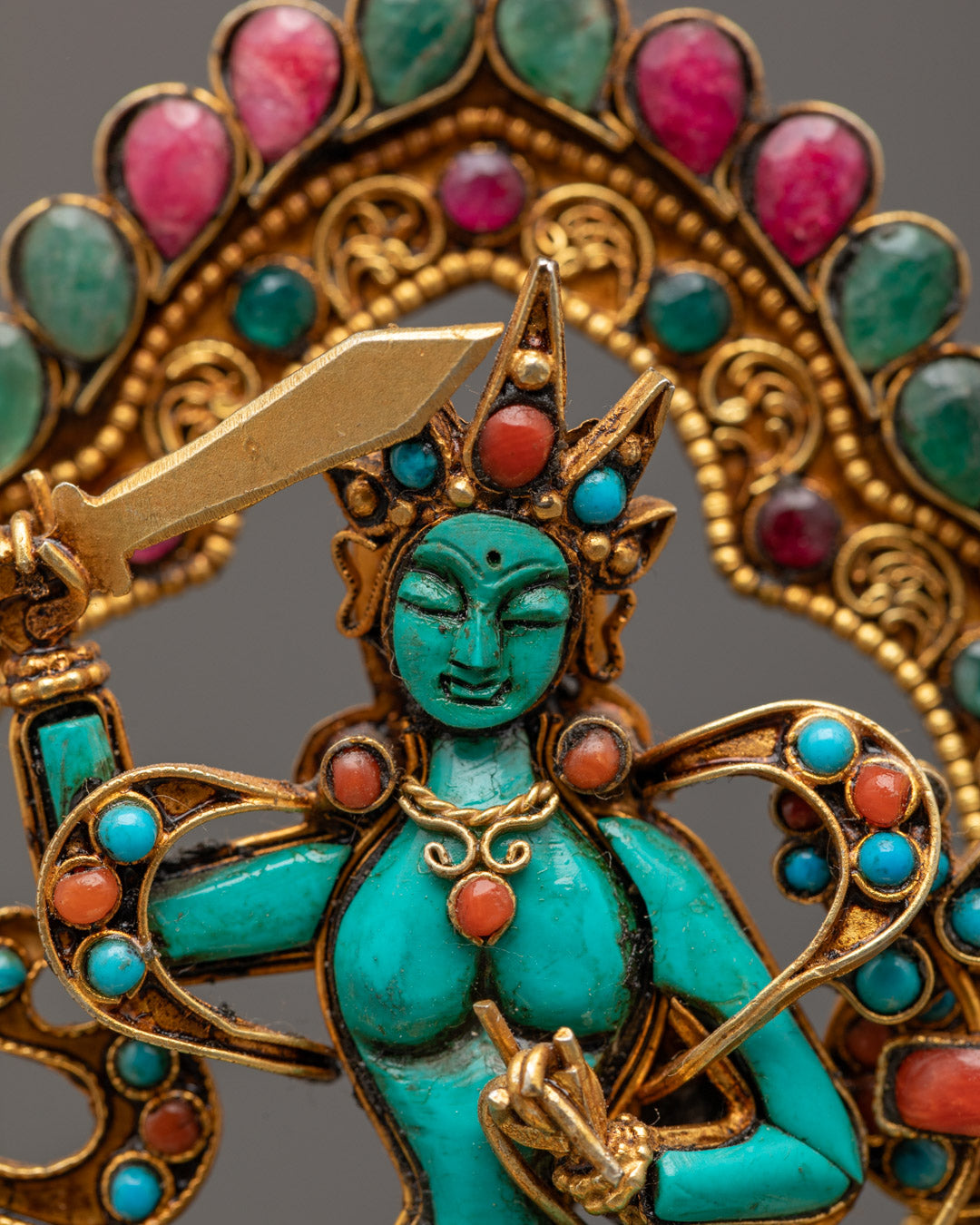 Close-up of Manjushri's serene face and detailed crown, showcasing traditional Himalayan craftsmanship.