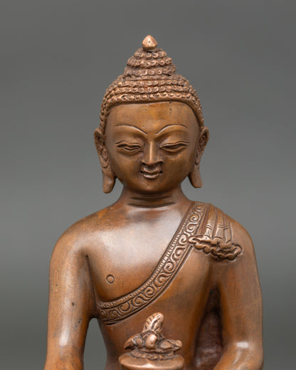 Close-up of Medicine Buddha face, showing serene expression and detailed craftsmanship