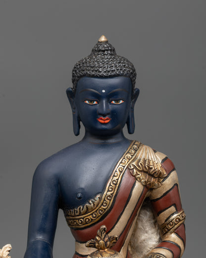 Close-up of Medicine Buddha holding monk’s bowl and myrobalan plant stem
