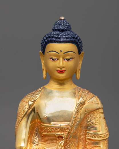 Close-up of Medicine Buddha statue showing intricate detailing on the monk’s bowl