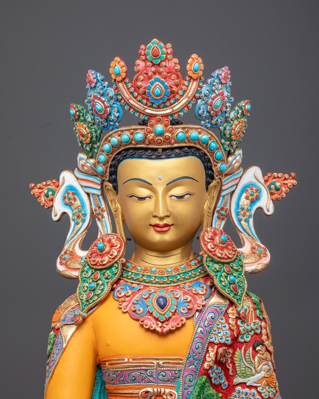 Mitrugpa statue face showcasing intricate copper detailing and serene expression