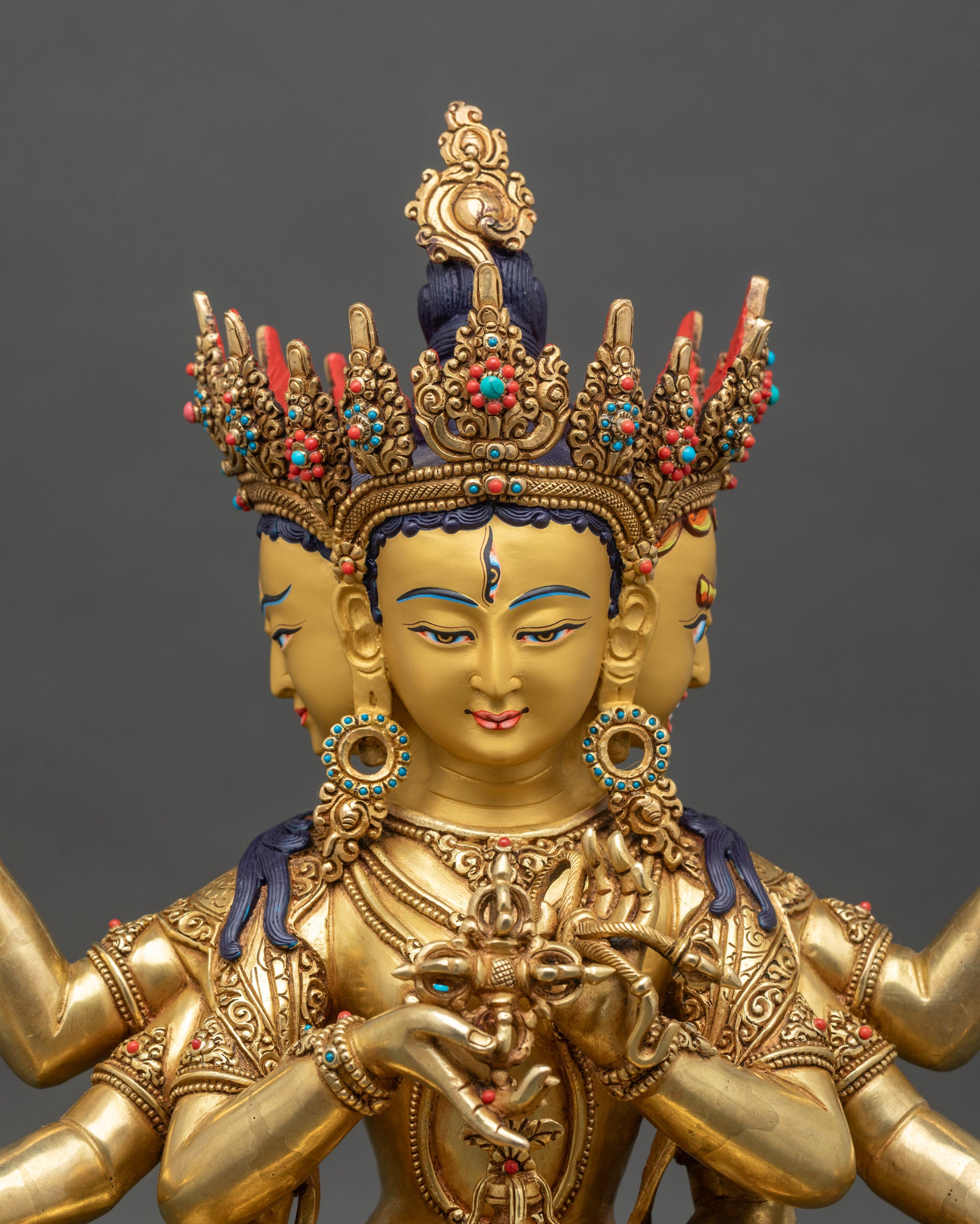 Close-up of Namgyalma Bodhisattva statue showing intricate gold-gilded details