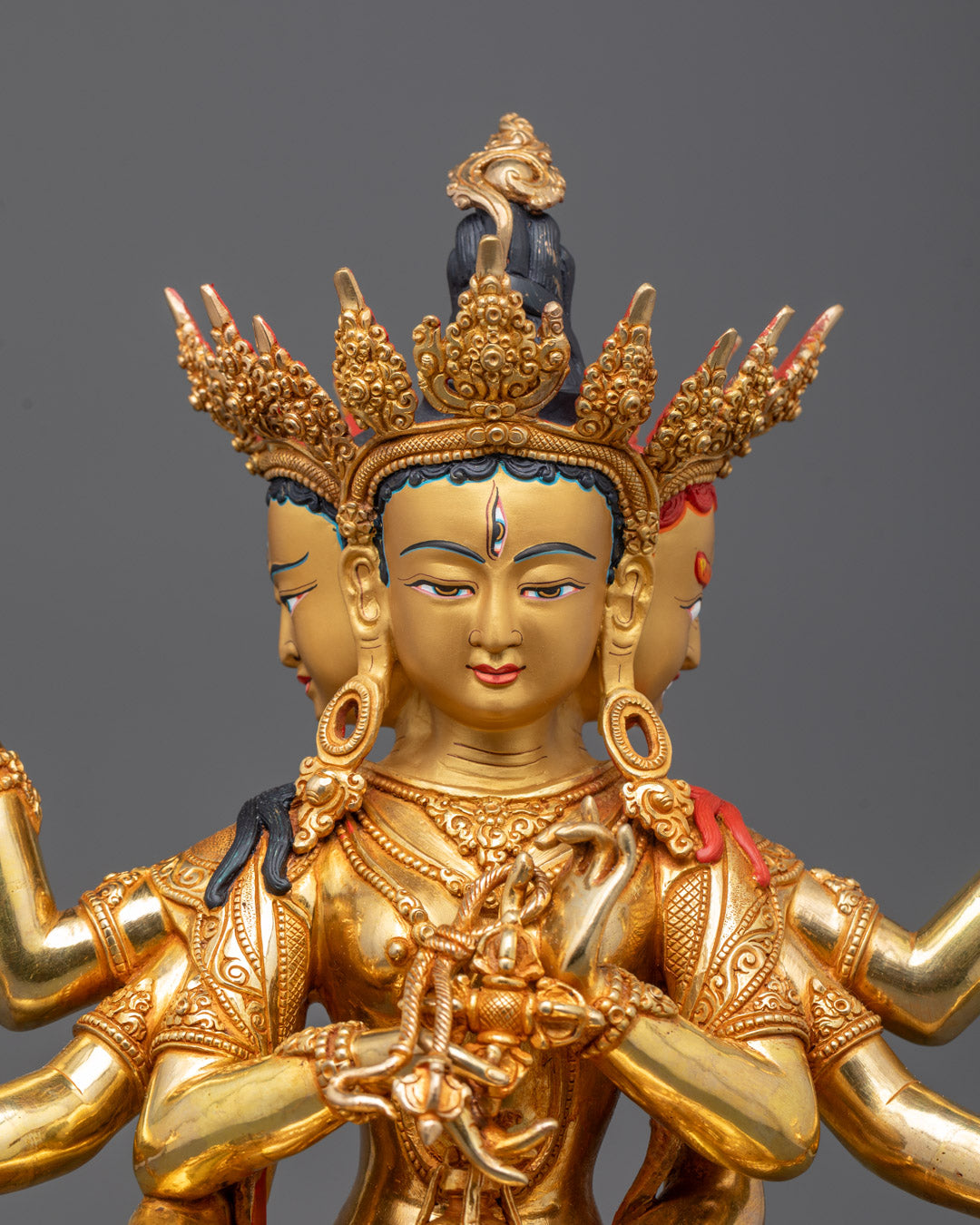 Close-up of Namgyalma Statue’s serene gold-gilded face, handcrafted in Patan