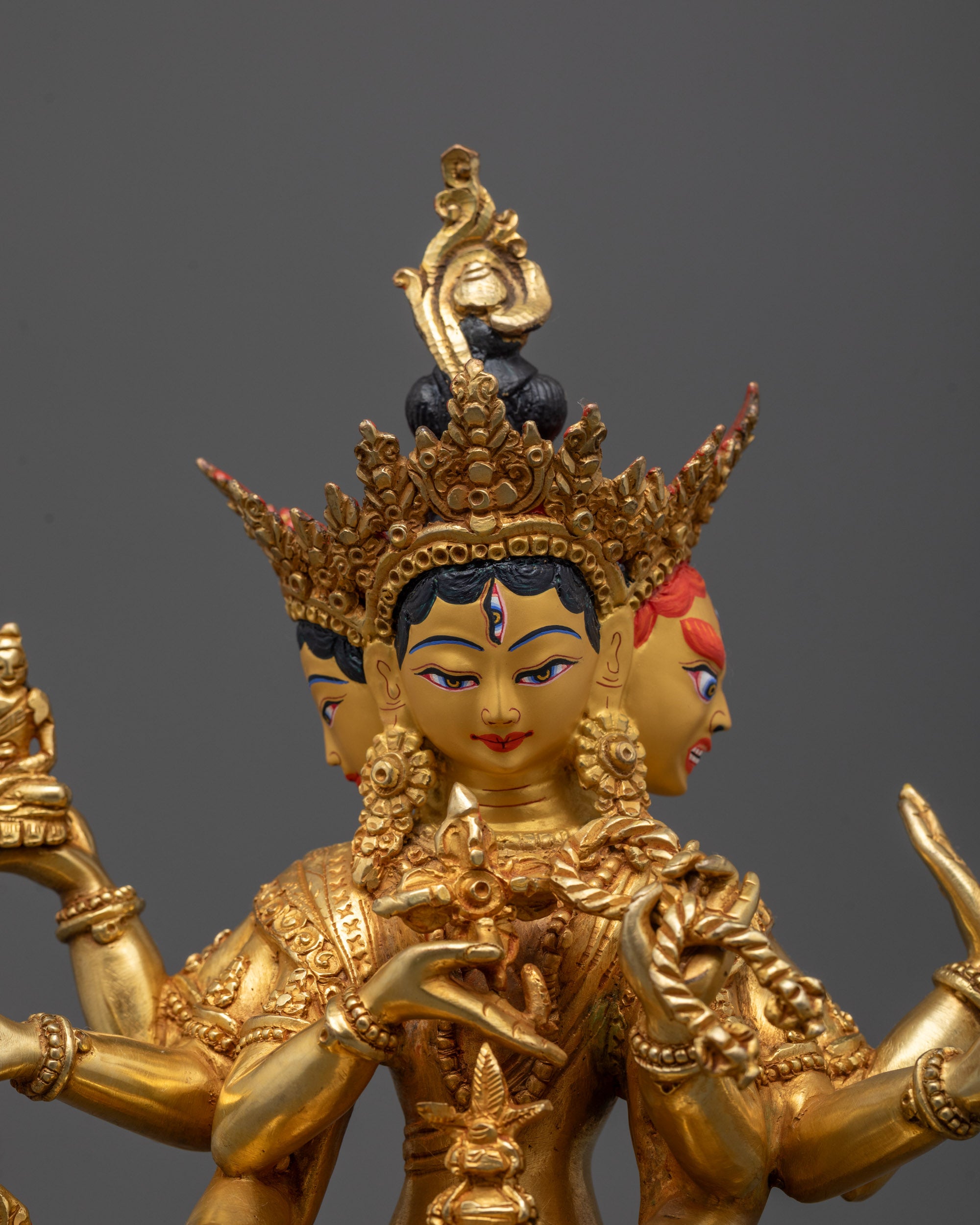 Close-up of Namgyalma’s serene central face with intricate crown detailing