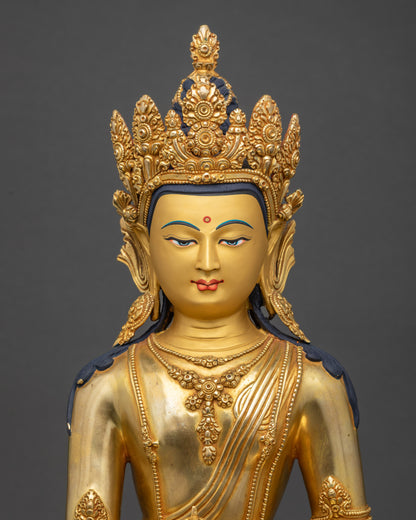 Close-up of Nepalese Mitrugpa statue showing intricate monk’s robes and gold-painted serene face