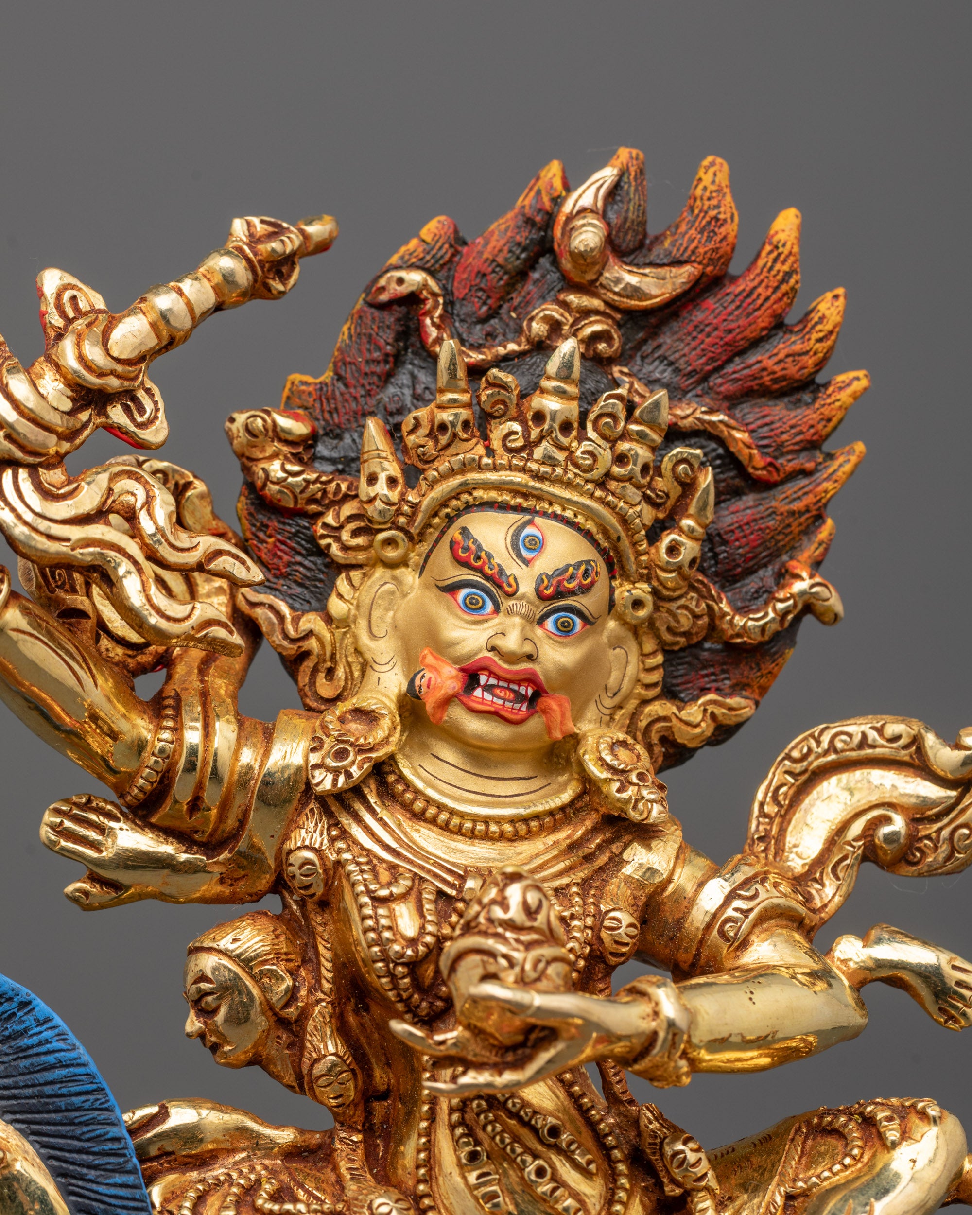 Close-up of Palden Lhamo’s fierce expression with a crafted halo
