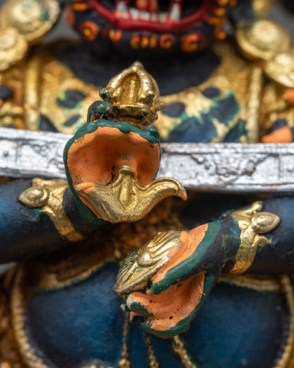 Close-up of Sakya Mahakala holding ritual kapala and kartika knife in hand
