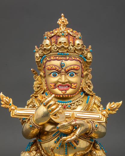 Close-up of Sakya Mahakala statue showing gold fire-gilding and wrathful posture