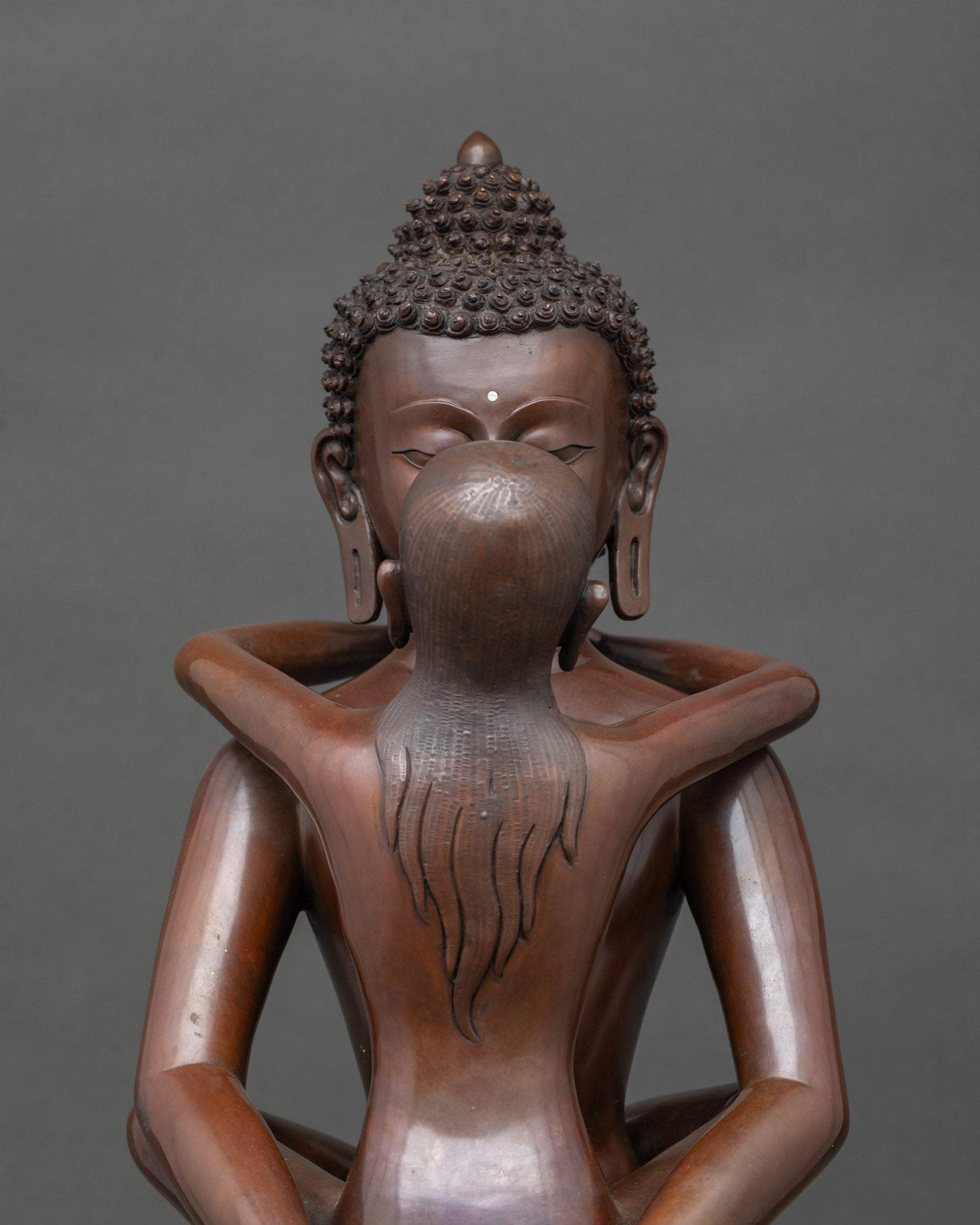 Close-up of Samantabhadra Bodhisattva statue face, intricate Himalayan craftsmanship