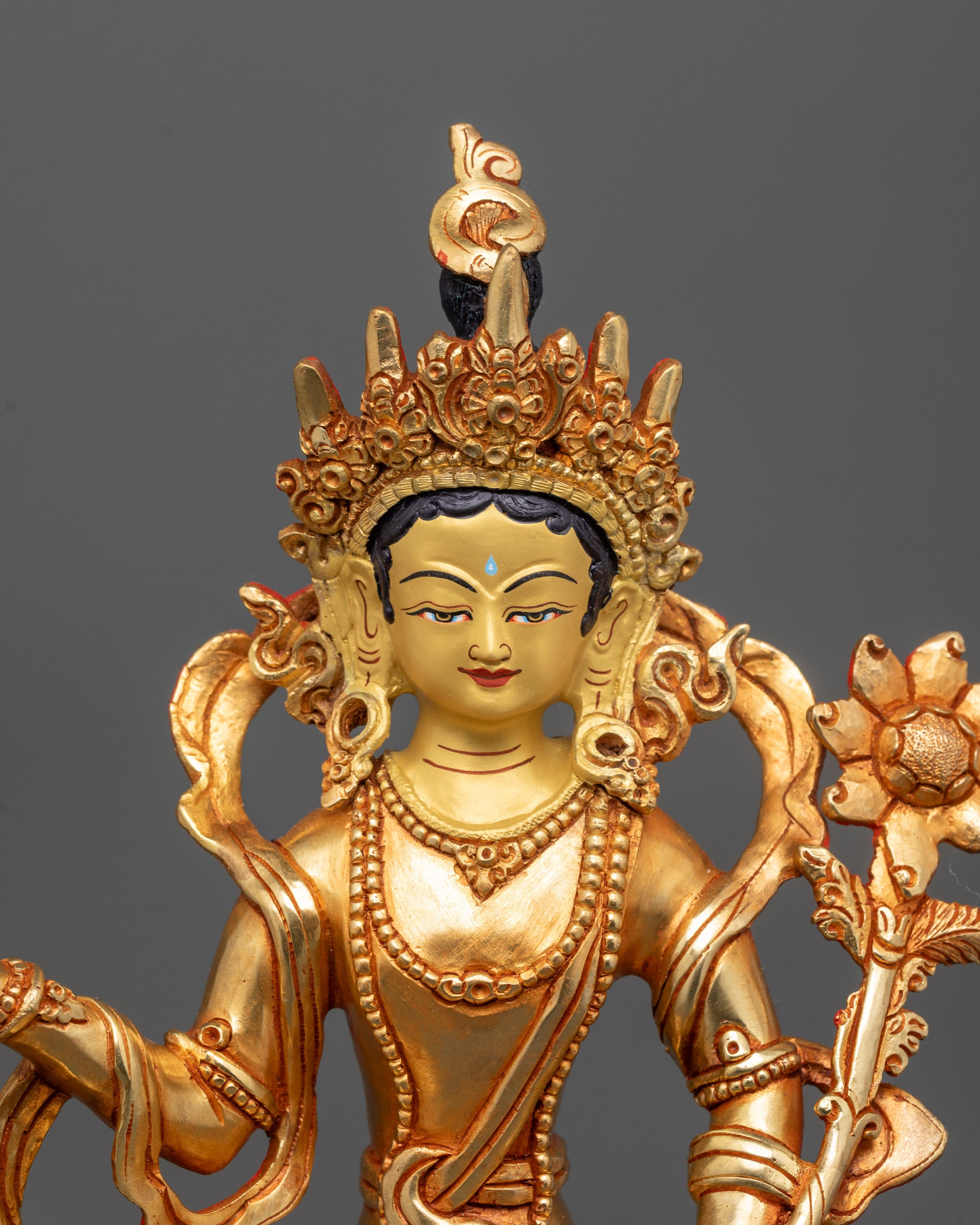 Close-up of Samantabhadra holding fully bloomed utpala flower with radiant halo