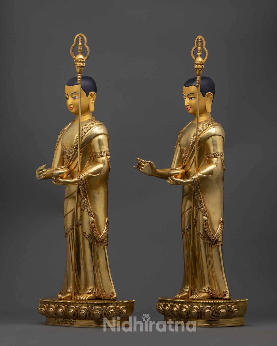 Sariputra and Maudgalyayana statues showing fine copper work, gold gilding, and multi-colored acrylic paint highlighting their serene expressions