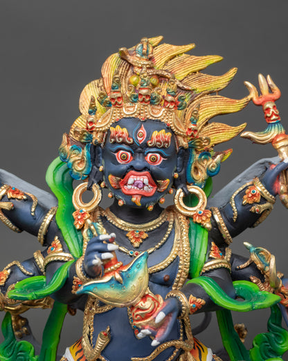 Close-up of Shadbhuja Mahakala statue showing vibrant acrylic colors and gold details