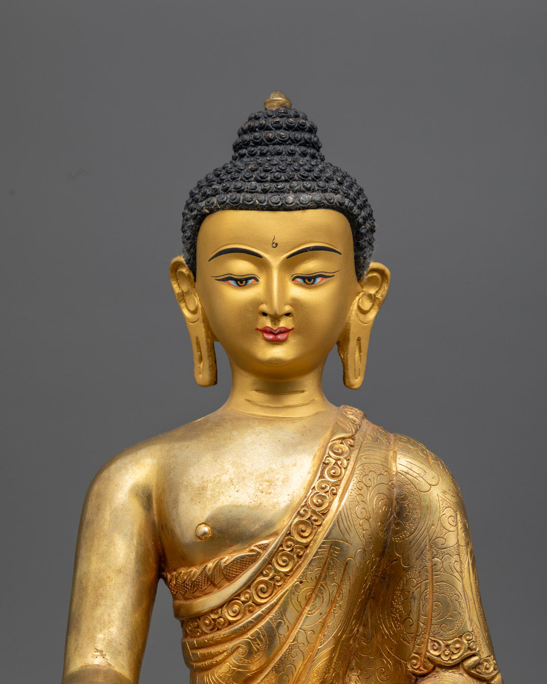 Close-up of Shakyamuni Buddha Face – 24k Gold-Gilded Copper Sculpture with Peaceful Expression