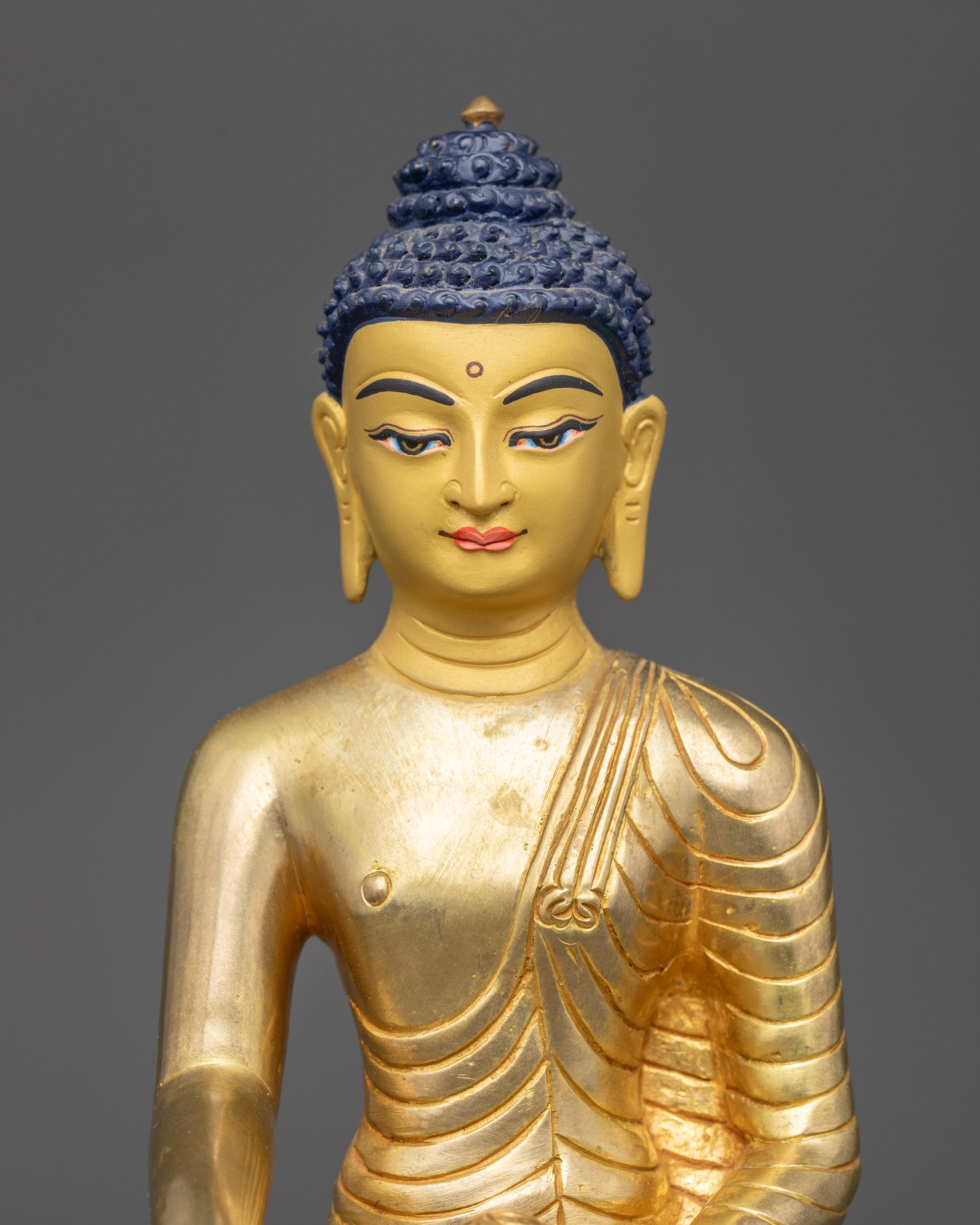 Close-up of Shakyamuni Buddha Face with Gold Fire-Gilding on Lotus Seat