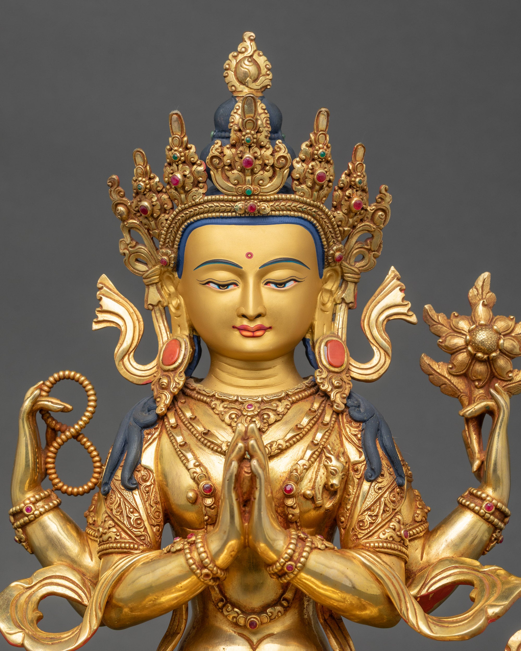 Close-up of Shakyamuni Buddha Statue showing gold-gilded copper details