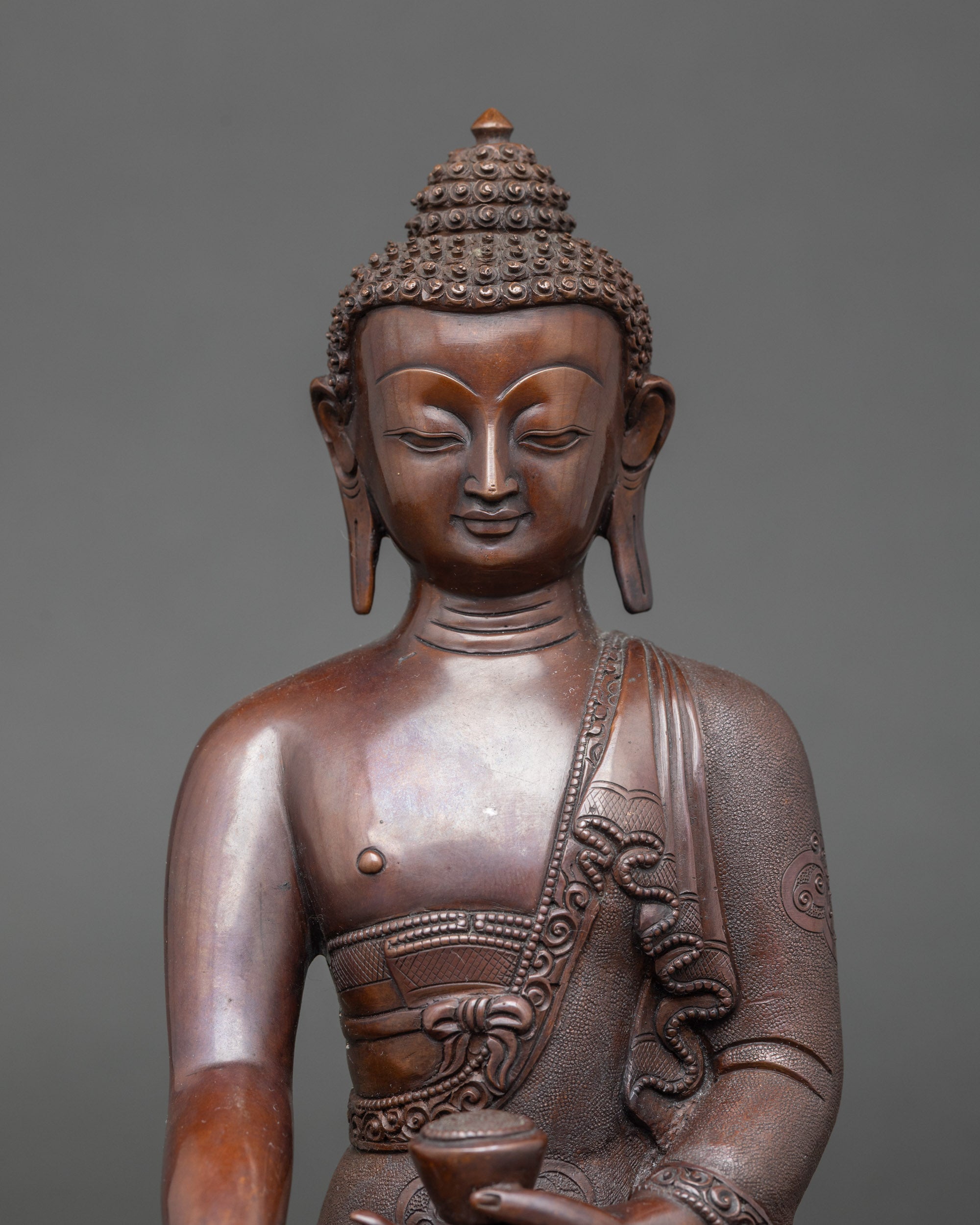 Close-up of Shakyamuni Buddha face, earth-touching Bhumisparsha mudra, meditation statue