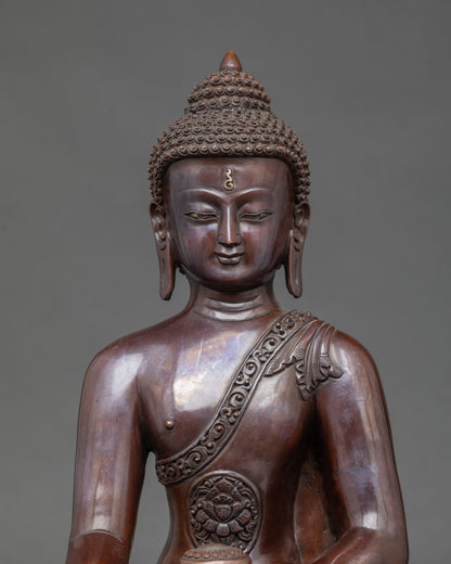 Close-up of Shakyamuni Buddha face, gold-gilded Newari artisan meditation statue