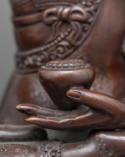 Close-up of Shakyamuni Buddha face showing serene expression and antique finish