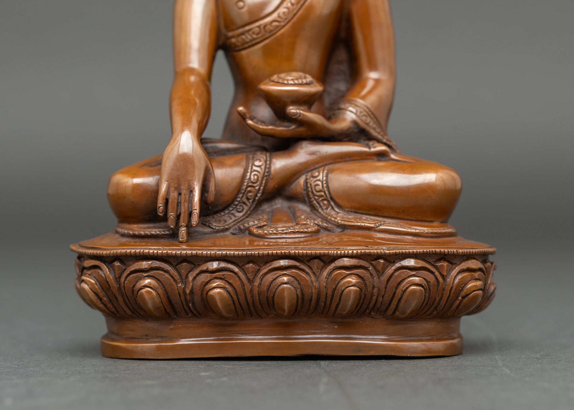 Close-up of Shakyamuni Buddha in Three Buddha altar set, lotus throne, detailed patina
