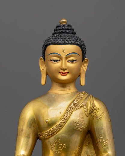 Close-up of Shakyamuni Buddha's serene face and gold-plated robe