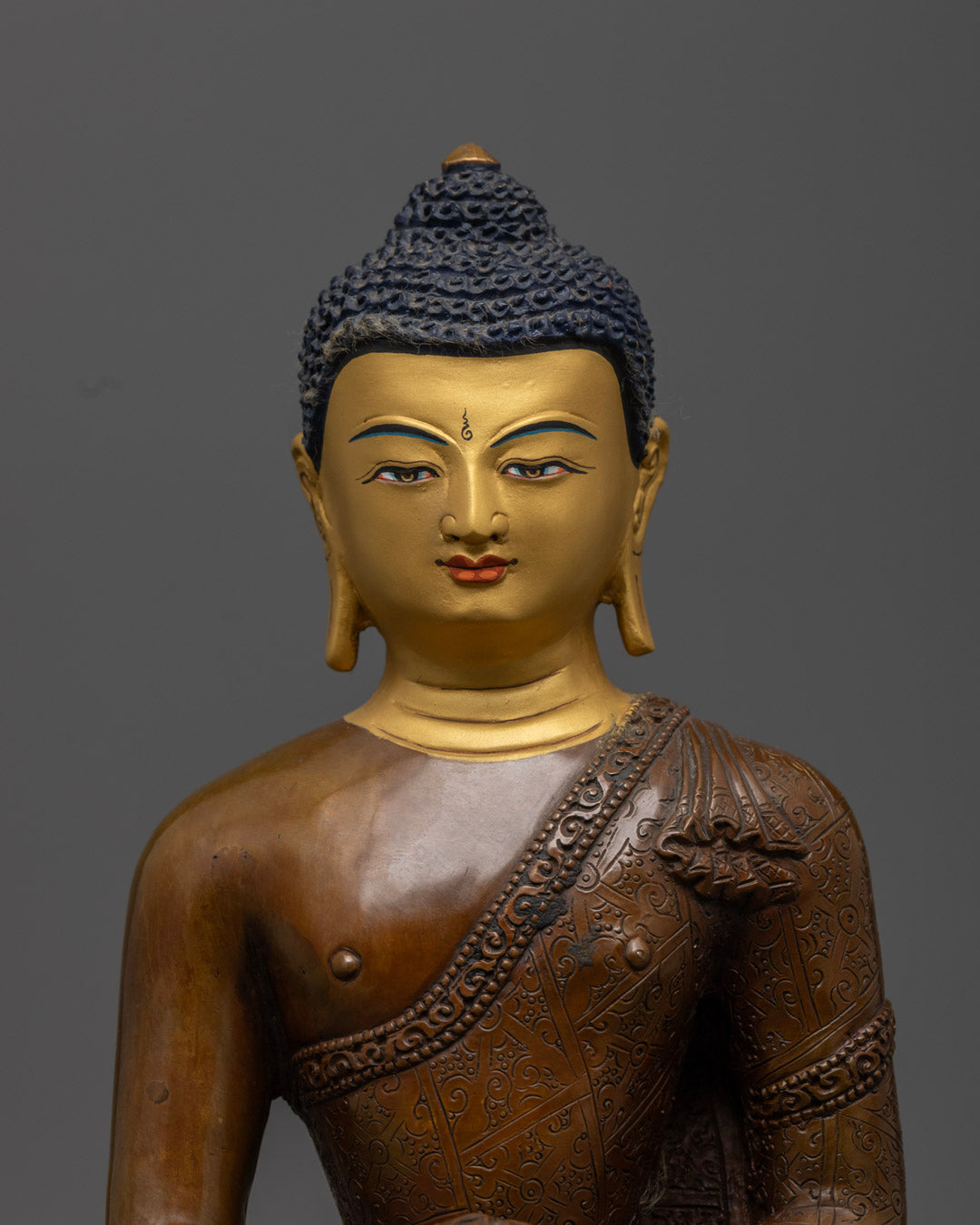 Shakyamuni Buddha's serene gold-coated face, symbolizing enlightenment and peaceful meditation