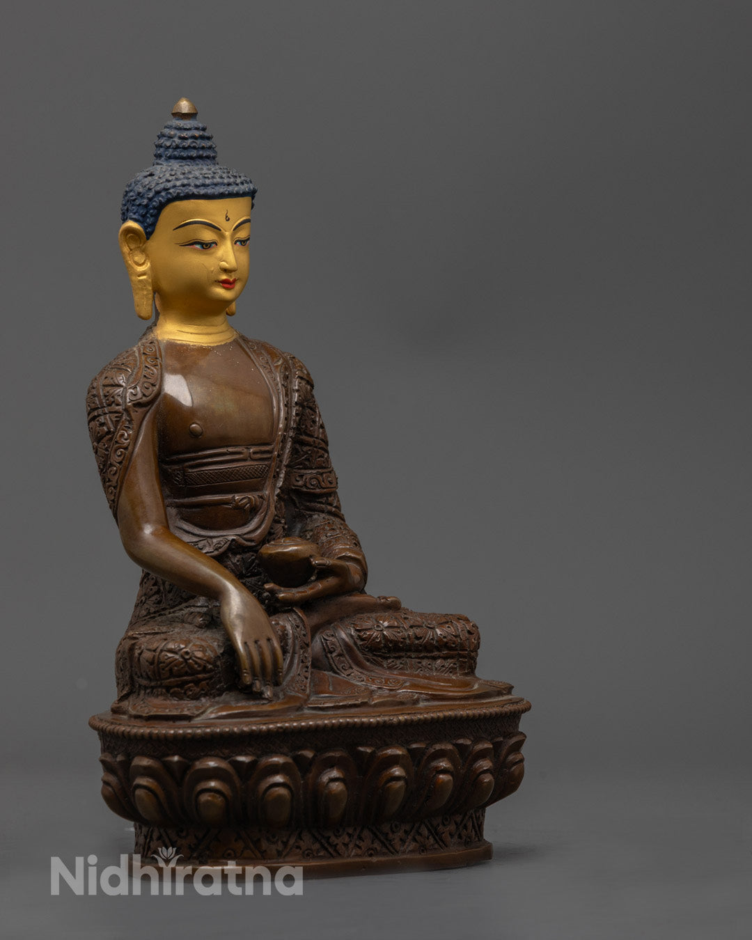 Shakyamuni statue's oxidized copper body showing intricate patina and artisan craftsmanship