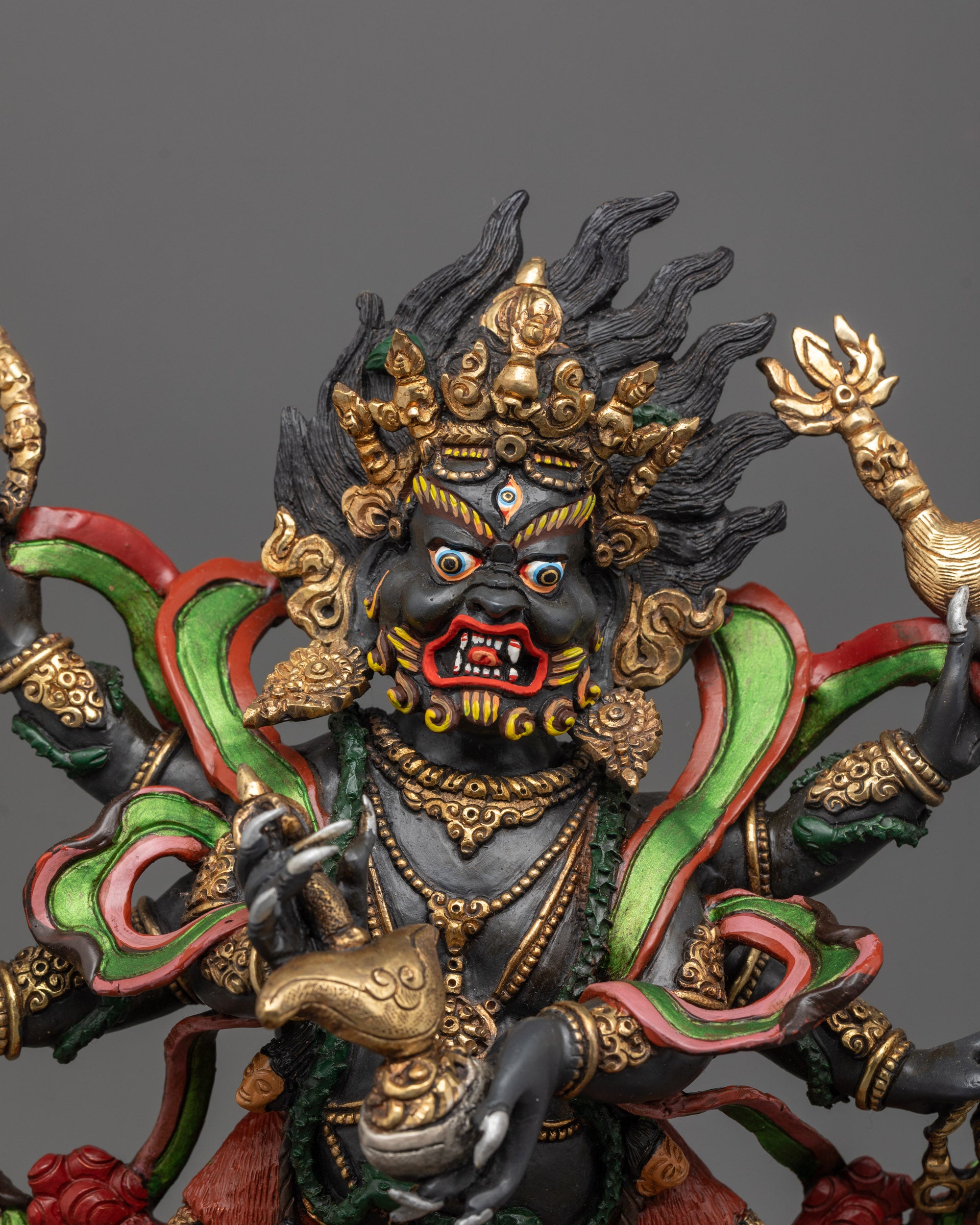 Close-up of Six-Armed Mahakala face showing third eye, detailed craftsmanship
