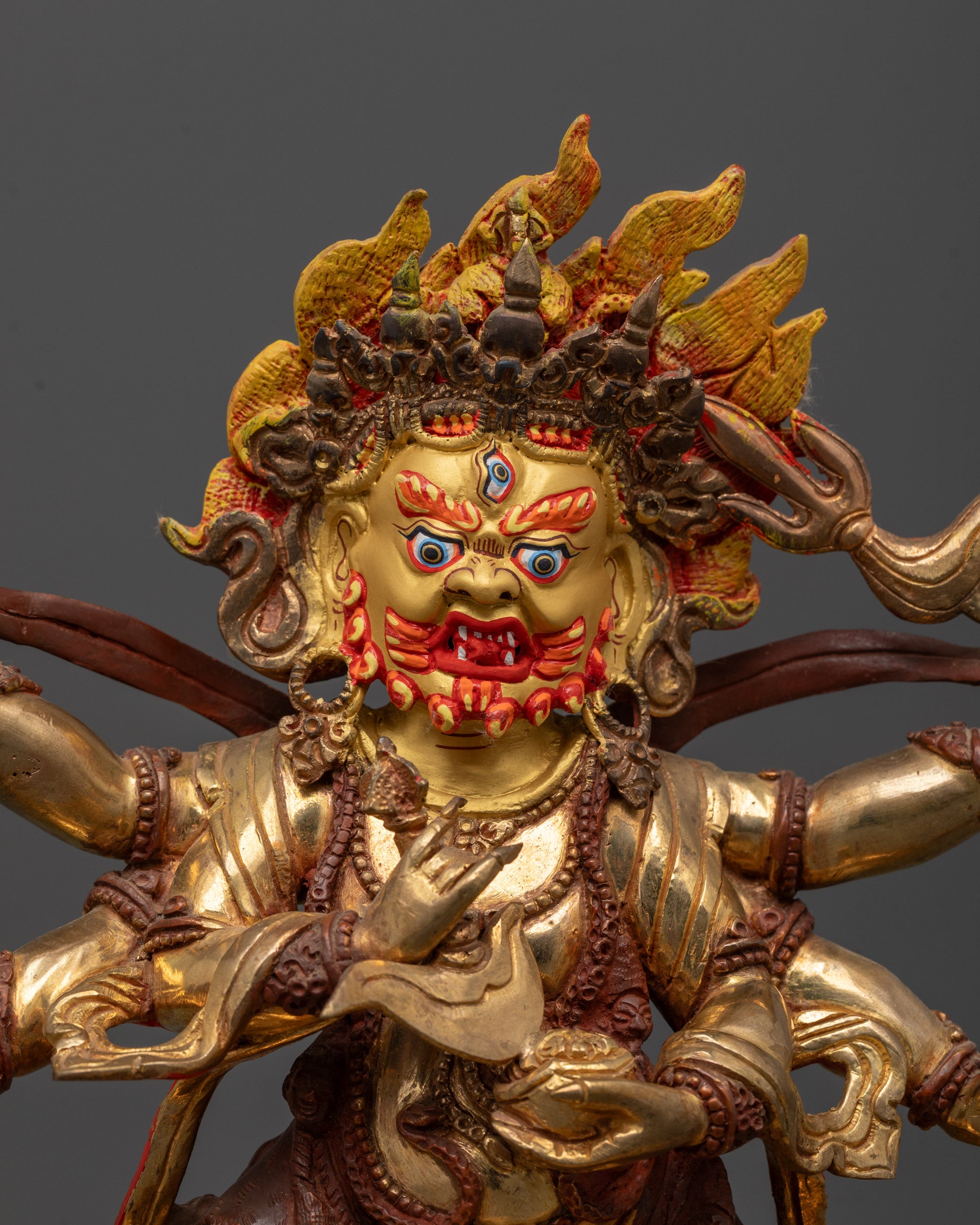 Close-up of Six-Armed Mahakala’s fierce face and radiant halo, showcasing intricate craftsmanship
