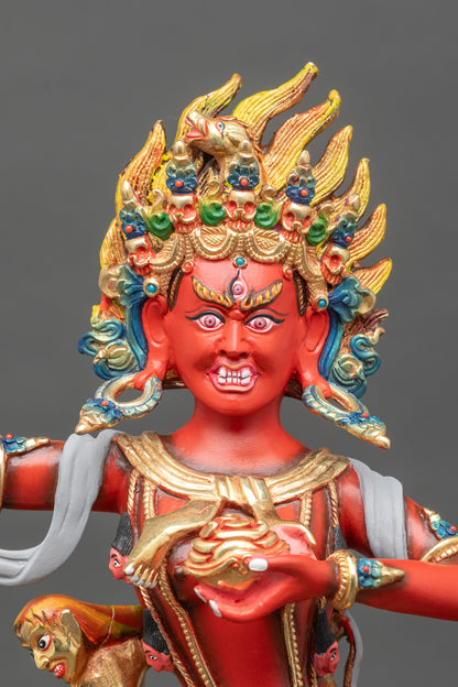Close-up of Troma Nagmo statue, copper body and detailed painted features