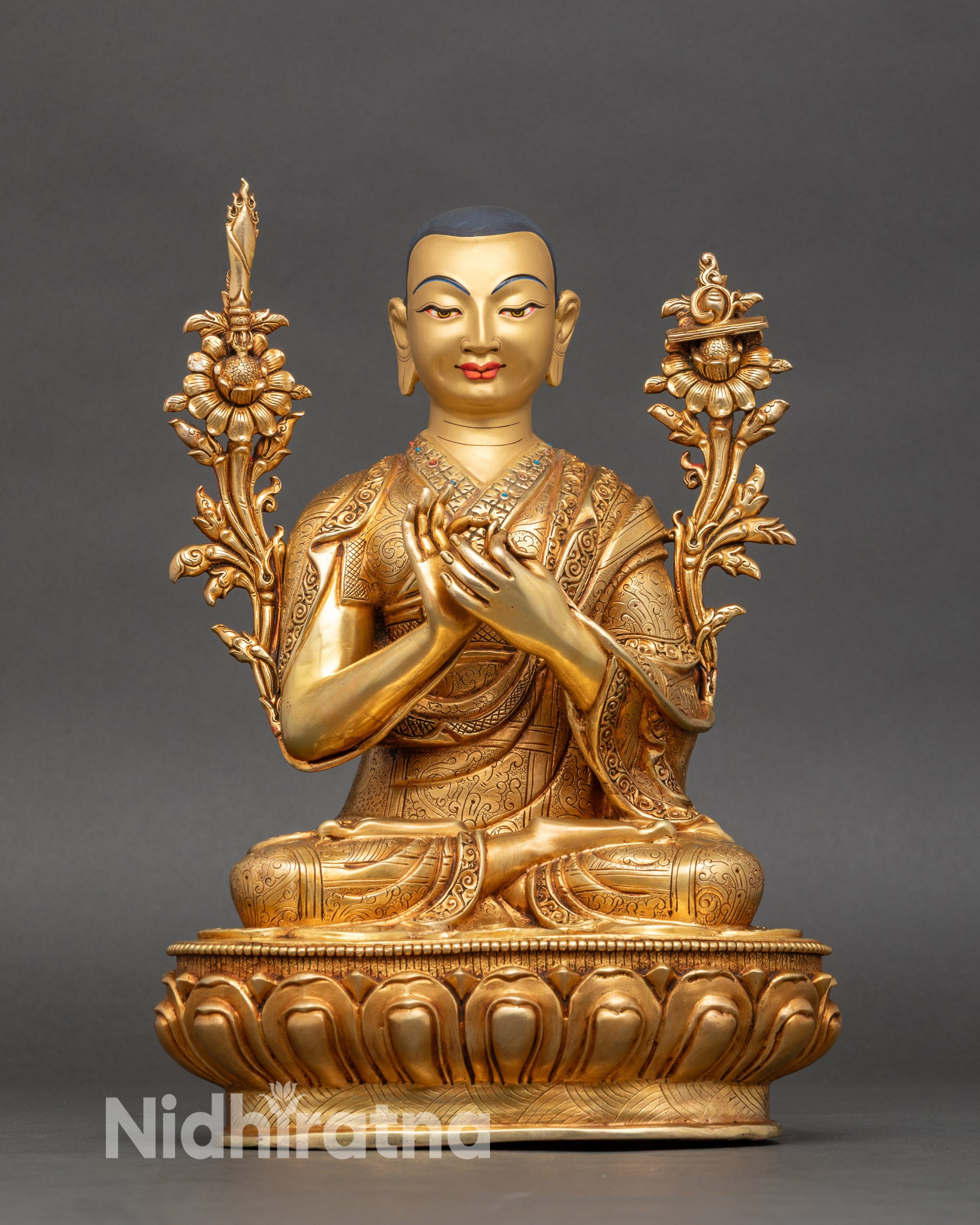 Close-up of Tsong Khapa statue showing intricate gold details and serene Newari craftsmanship
